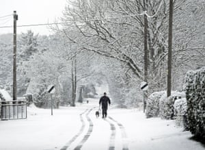 A man walks his dog near Malton in North Yorkshire