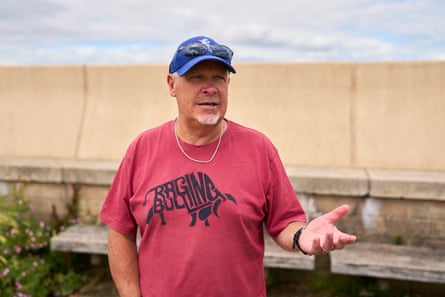 Dave Freer gestures with an open hand as he speaks on the seafront