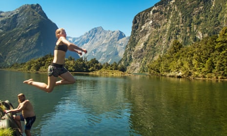 Swimmers jump in to Milford Sound in New Zealand