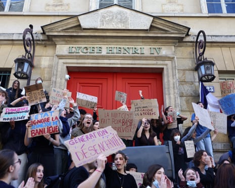 French high school students gather outside the Lycee Henri IV high school in Paris.
