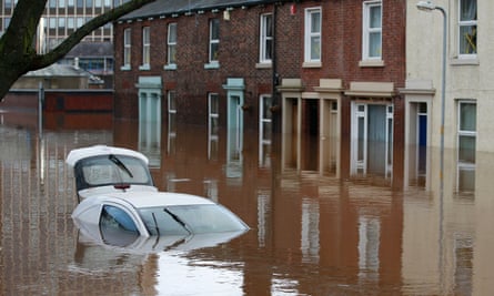 A car is submerged under floodwaters in Carlisle city centre.