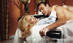 Sean Connery in Goldfinger, 1964, with Shirley Eaton as Jill Masterson.