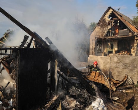 A firefighter works at the site of the Russian missile strike, amid Russia’s attack on Ukraine, in the village of Sknyliv on the outskirts of Lviv, Ukraine.