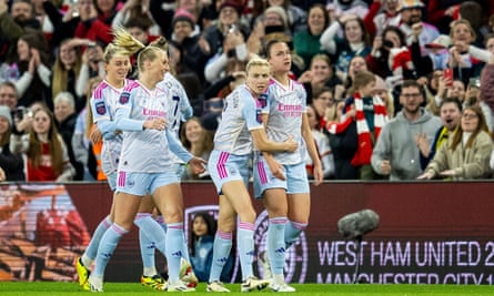 Lotte Wubben-Moy (furthest right) takes the acclaim of her teammates and fans after scoring the goal that put Arsenal in front.