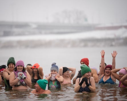Winter swimming enthusiasts take a dip in the icy waters of the Vistula River in Warsaw, Poland