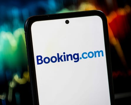 Booking.com logo displayed on a smartphone