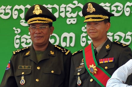 Hun Sen, left, with his son Hun Manet during a ceremony at a military base in Phnom Penh on 13 October 2009.