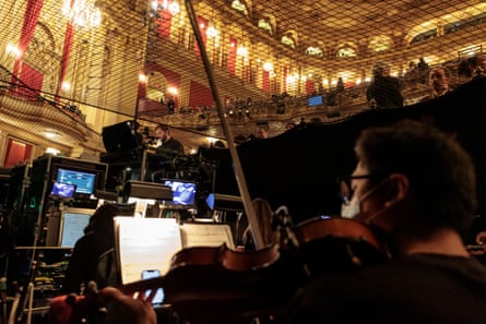 Musical director Manny Schvartzman warms up at his keyboard alongside members of the orchestra before the touring broadway show “Hamilton” begins at the Citizens Opera House on October 15, 2025.
