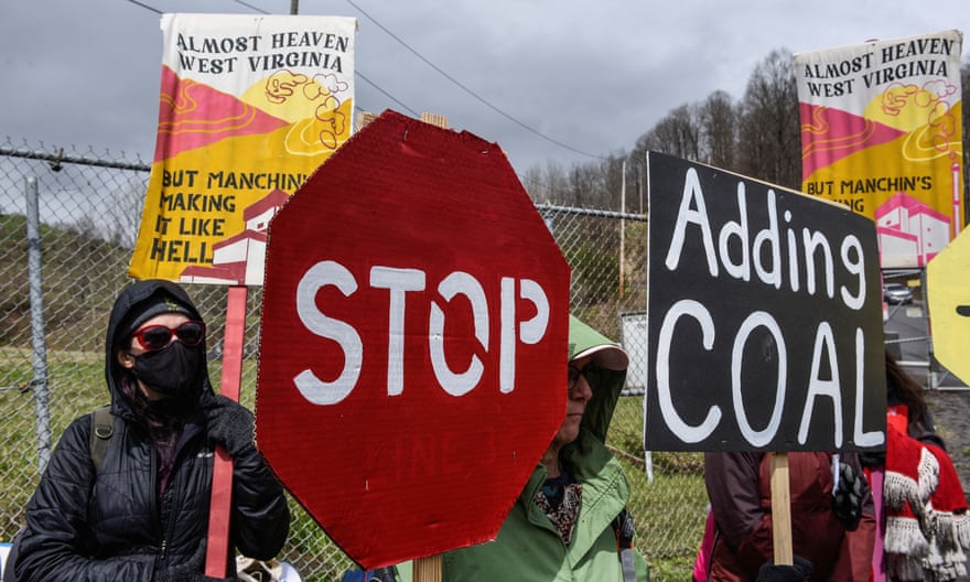 People protest against Manchin in West Virginia in April.