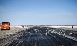 Gold, silver and precious metal bars on the runway of the airport of Yakutsk, Siberia. A plane dumped more than three tons on the runway of an airport following a problem during take-off.
