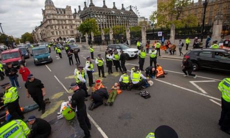 Police arresting Insulate Britain activists blocking road