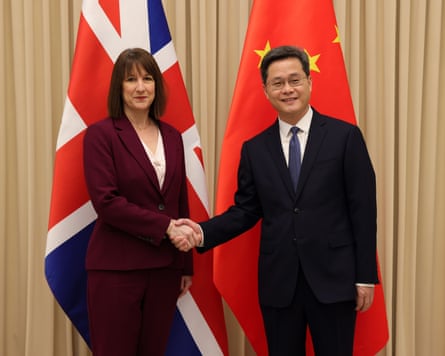 Reeves and Lan shaking hands