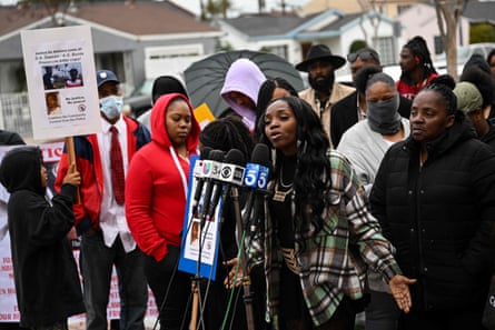 people gather behind microphone