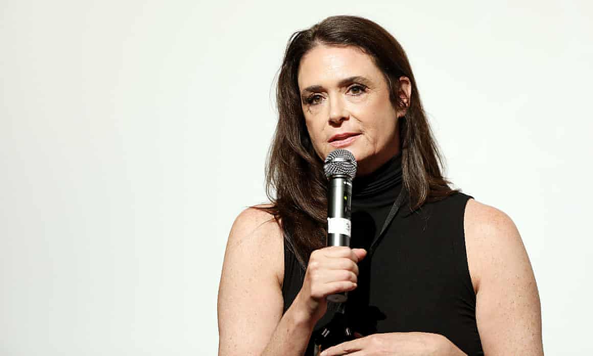 Stacey Williams speaking into a microphone