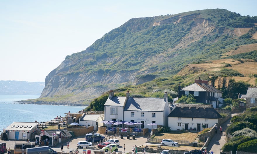 The Anchor Inn, with Golden Cap looming behind it