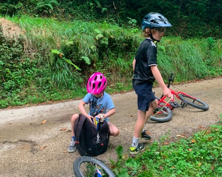 two young boys with bikes and cycle helmets