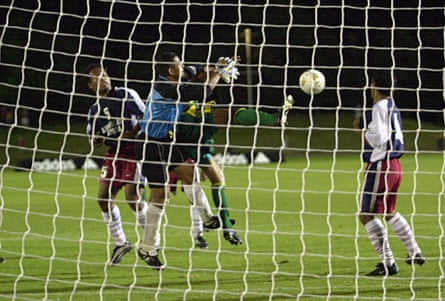 Archie Thompson of the Socceroos gets a goal past Nicky Salapu of American Sāmoa during the Oceania group one World Cup qualifier match in 2001