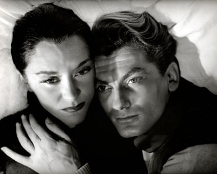 Black and white film still from Orphée of a man and woman embracing