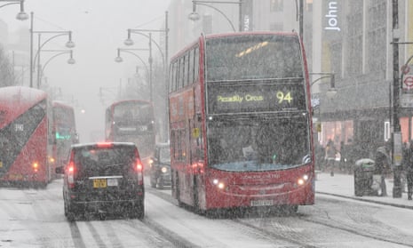 Shoppers on Oxford Street in central London brave the snow.