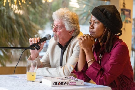 (From left) Murray McCartney speaks into a microphone, sitting next to NoViolet Bulawayo at the launch of her Booker shortlisted ‘Glory’ in Harare, 2022.