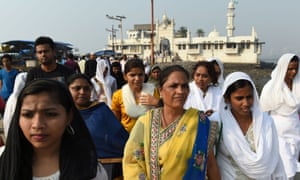 Indian women leave after visiting the inner sanctum of the Haji Ali Dargah in Mumbai.