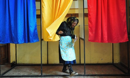 An Romanian woman leaves the voting cabin in the 2009 European elections.