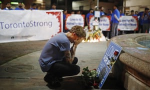 A vigil remembering the victims of a shooting on Sunday in Toronto, Canada. 5034.jpg?w=300&q=55&auto=format&usm=12&f