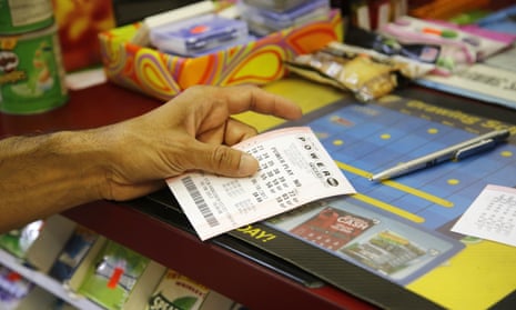 A customer buys a Powerball ticket, Thursday, June 8, 2017, in Chicago. The Powerball jackpot has grown up to $435 million, after more than two months without a winner. The jackpot for Saturday night’s drawing would tie for the nation’s 10th largest lottery prize. (AP Photo/G-Jun Yam)