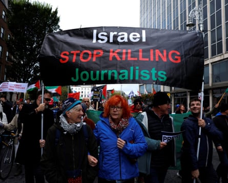 Demonstrators hold a banner reading “Israel stop killing journalists” in support of Palestinians during a national protest in Dublin