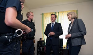 David Cameron, then UK prime minister, and Theresa May, then home secretary, with Home Office officers in 2014 at a house where several migrants were arrested in Berkshire. 3500.jpg?width=300&quality=85&auto=forma