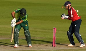 Fakhar Zaman of Pakistan is bowled by Moeen Al as England wicketkeeper Jonny Bairstow looks on.