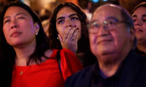 People watch the CNN presidential debate between US President Joe Biden and Republican presidential candidate former President Donald Trump at a debate watch party at Shaws Tavern on 27 June 2024 in Washington, DC.