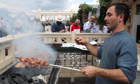 man grilling shish kebabs at Shashlik Live festival in Moscow’s Gorky Park