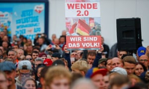 A banner reads “We are the people” at a protest in Chemnitz.