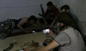 Rebel fighters in Aleppo follow news about Donald Trump’s election as US president.