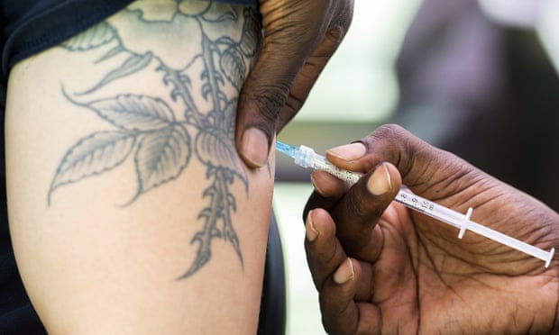 A man receives a monkeypox vaccine at an outdoor walk-in clinic in Montreal.