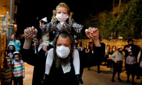 Ultra-Orthodox Jews in Israel, here celebrating Lag BaOmer on 11 May, have been less stressed by the pandemic than their non-religious neighbours.