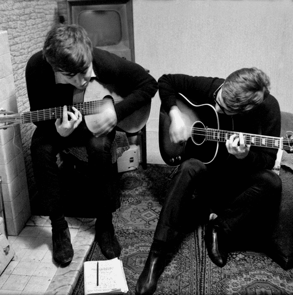 Two songwriters with guitars