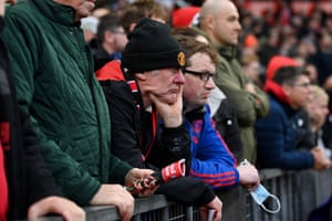 Manchester United fans looks dejected.