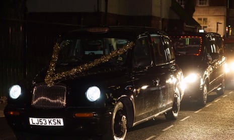 London’s black cab drivers deliver Christmas presents to homeless people earlier this month.