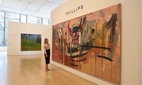 Phillips’s global chair, Cheyenne Westphal, stands next to  a Jean-Michel Basquiat work in London, February 2022.