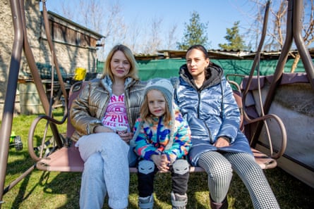 Liza Zinova (left) with Maria Ustenko and her three-year-old daughter Mila in the village of Pchery Theodor, near Prague.