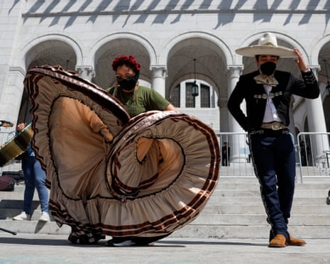 People dance outside of City Hall during a rally in Los Angeles.