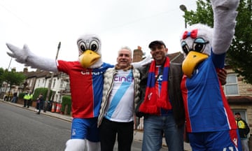 Crystal Palace fans with mascots outside the stadium.