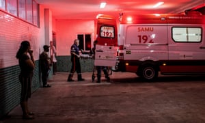 Nurses transport a patient infected with coronavirus to the 28 de Agosto Hospital, in Manaos, Brazil, 4 January 2021.