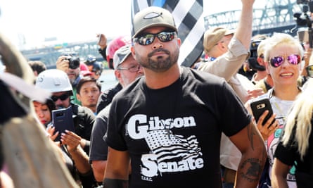 Joey Gibson stands with far-right demonstrators in Portland, last year.