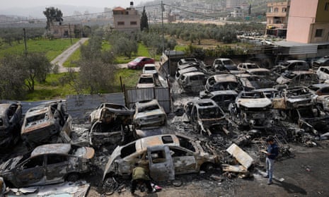 Burnt-out cars in a Palestinian town on the West Bank