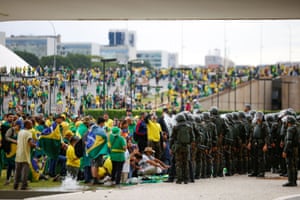 Security forces operate as Bolsonaro supporters storm the National Congress.