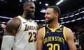 The Lakers' LeBron James, left, and the Warriors' Steph Curry talk with each other after a January game at Chase Center in San Francisco, California.