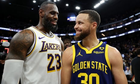 The Lakers’ LeBron James, left, and the Warriors’ Steph Curry talk with each other after a January game at Chase Center in San Francisco, California.